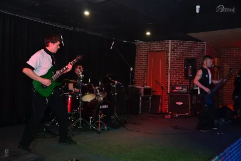 Guitarist and drummer during a performance.