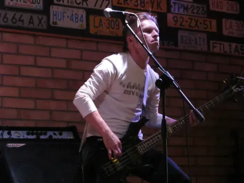 A vocal and guitar performance.