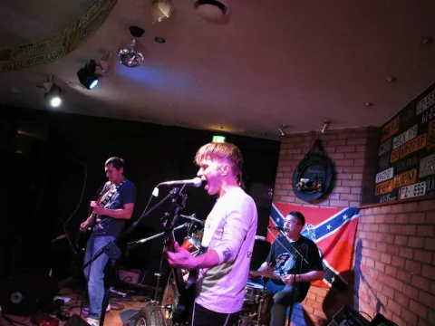 The band during a live performance.